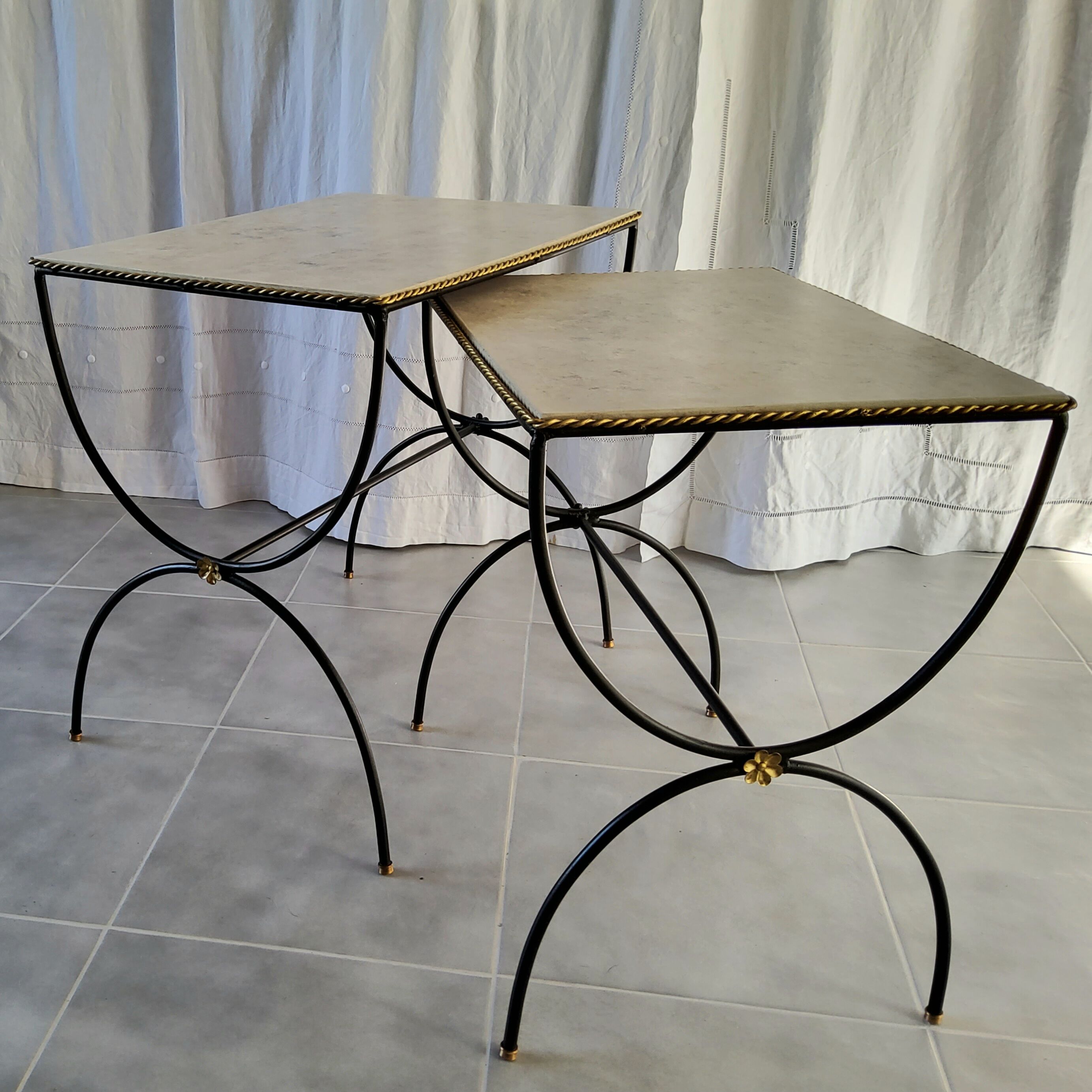 Pair of curule nesting tables