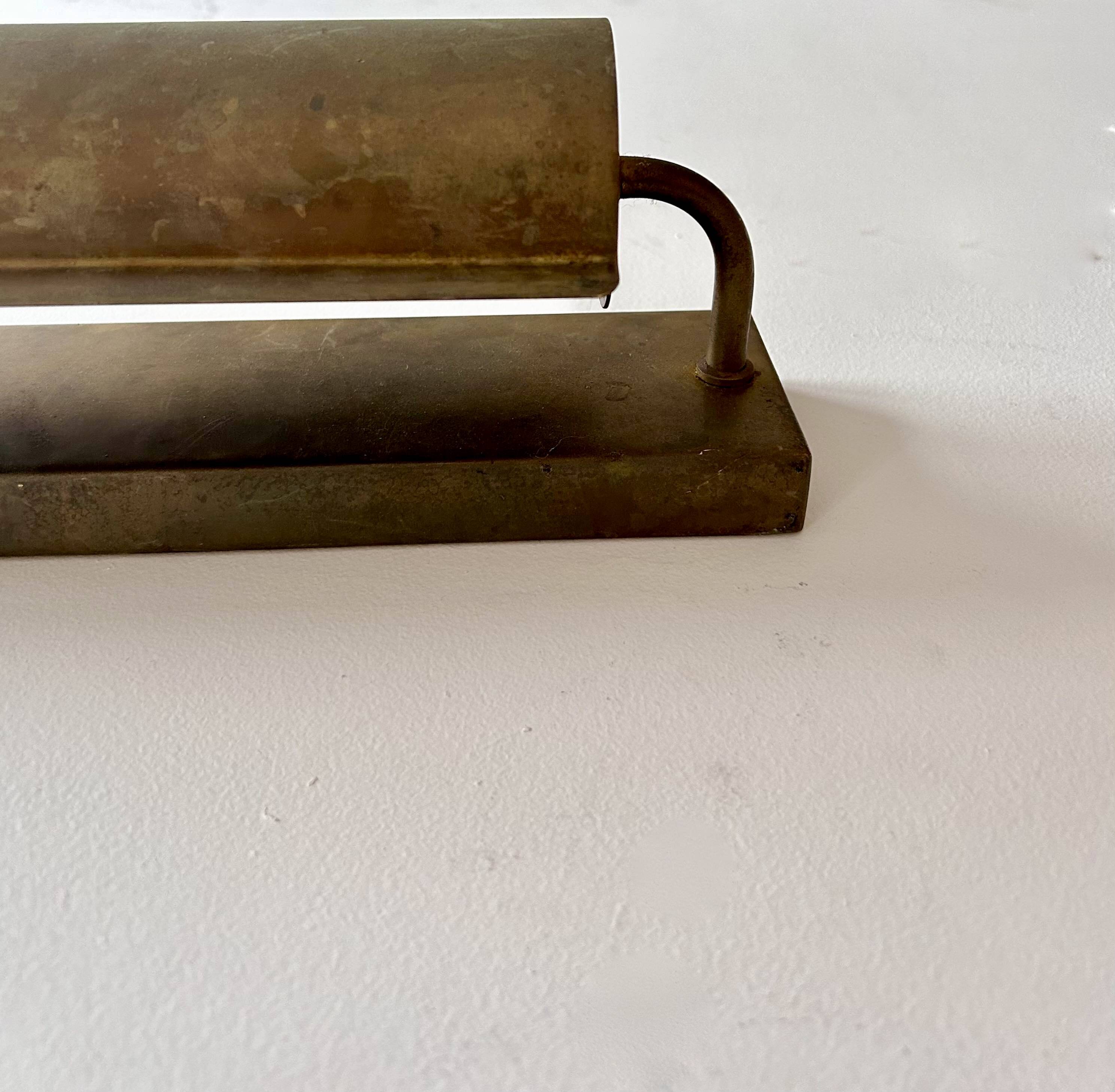 Modernist solid brass wall light, France 1940