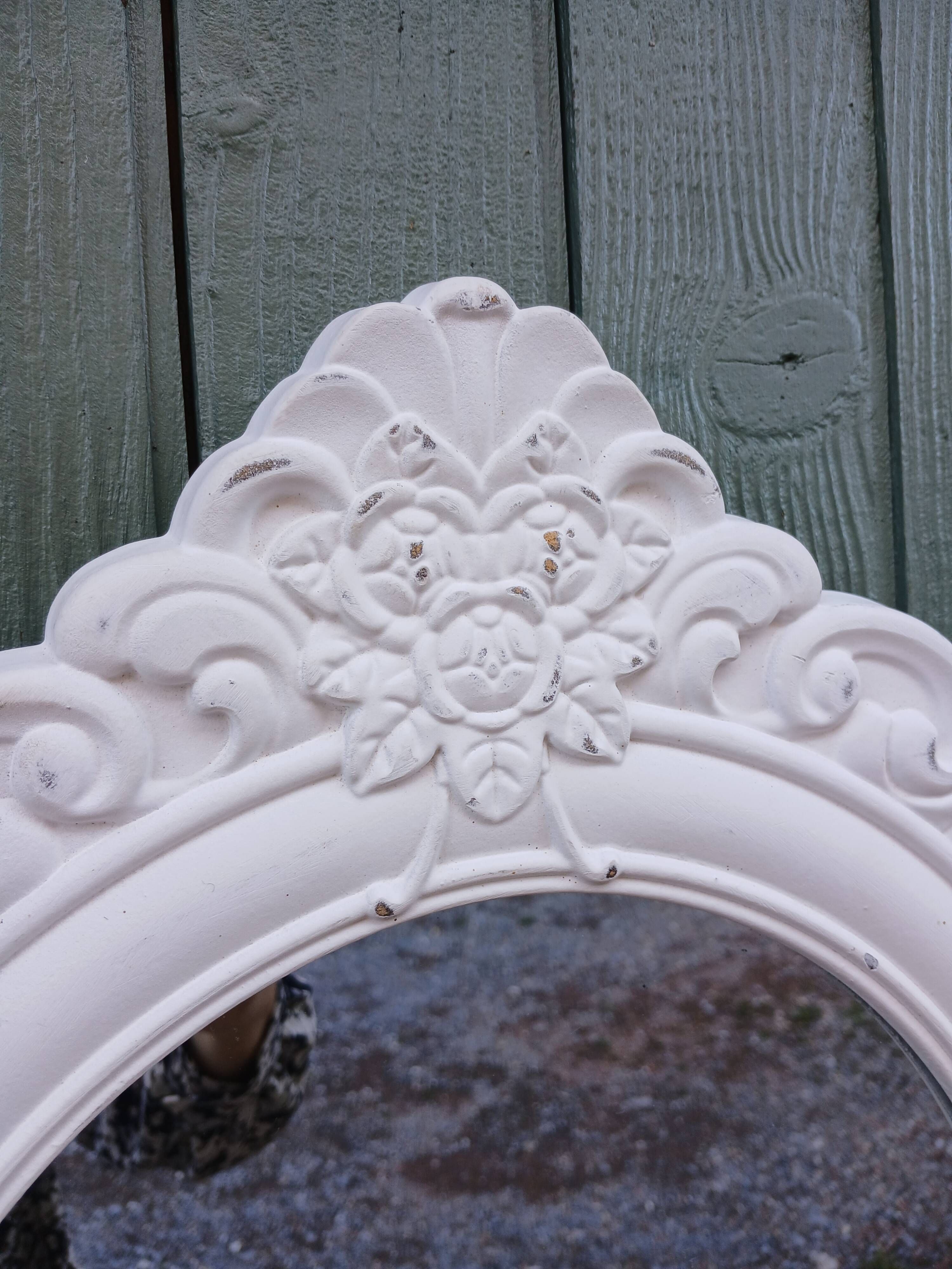 Oval mirror with white frame