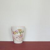 Vintage beige high flowerpot with flowers