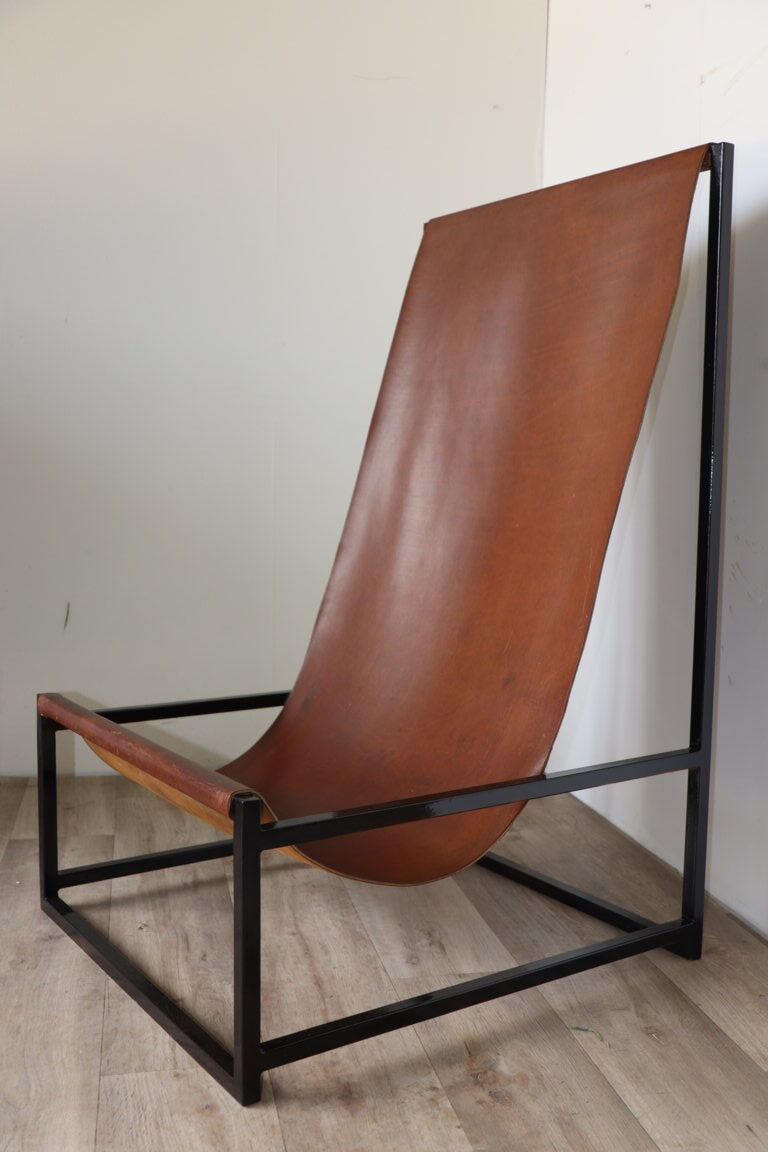 Pair of vintage armchairs in stretched leather and metal structure
