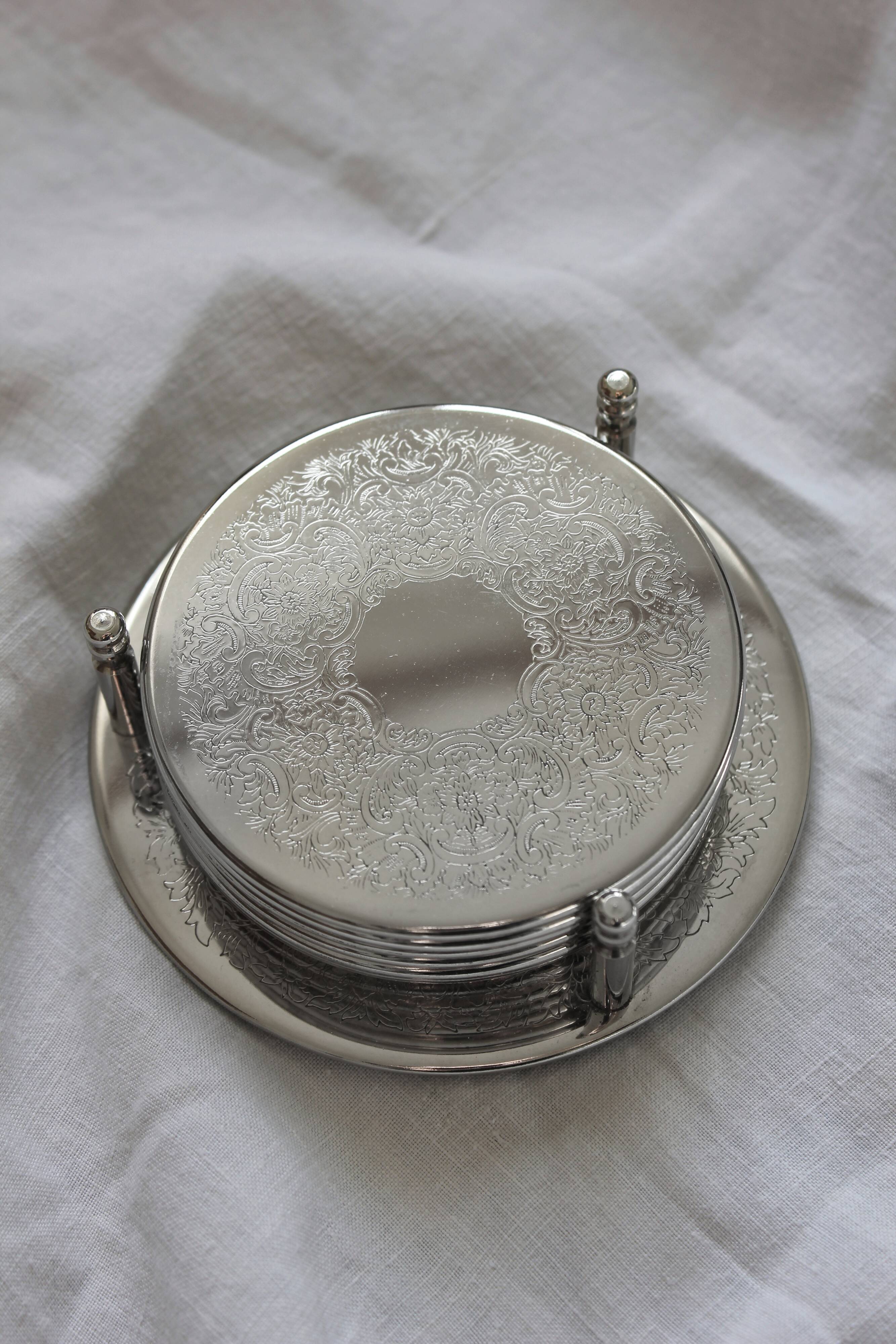 6 vintage chiseled silver metal coasters