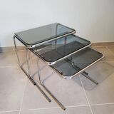 Set of 3 nesting tables with chrome metal legs and smoked glass from the 70s