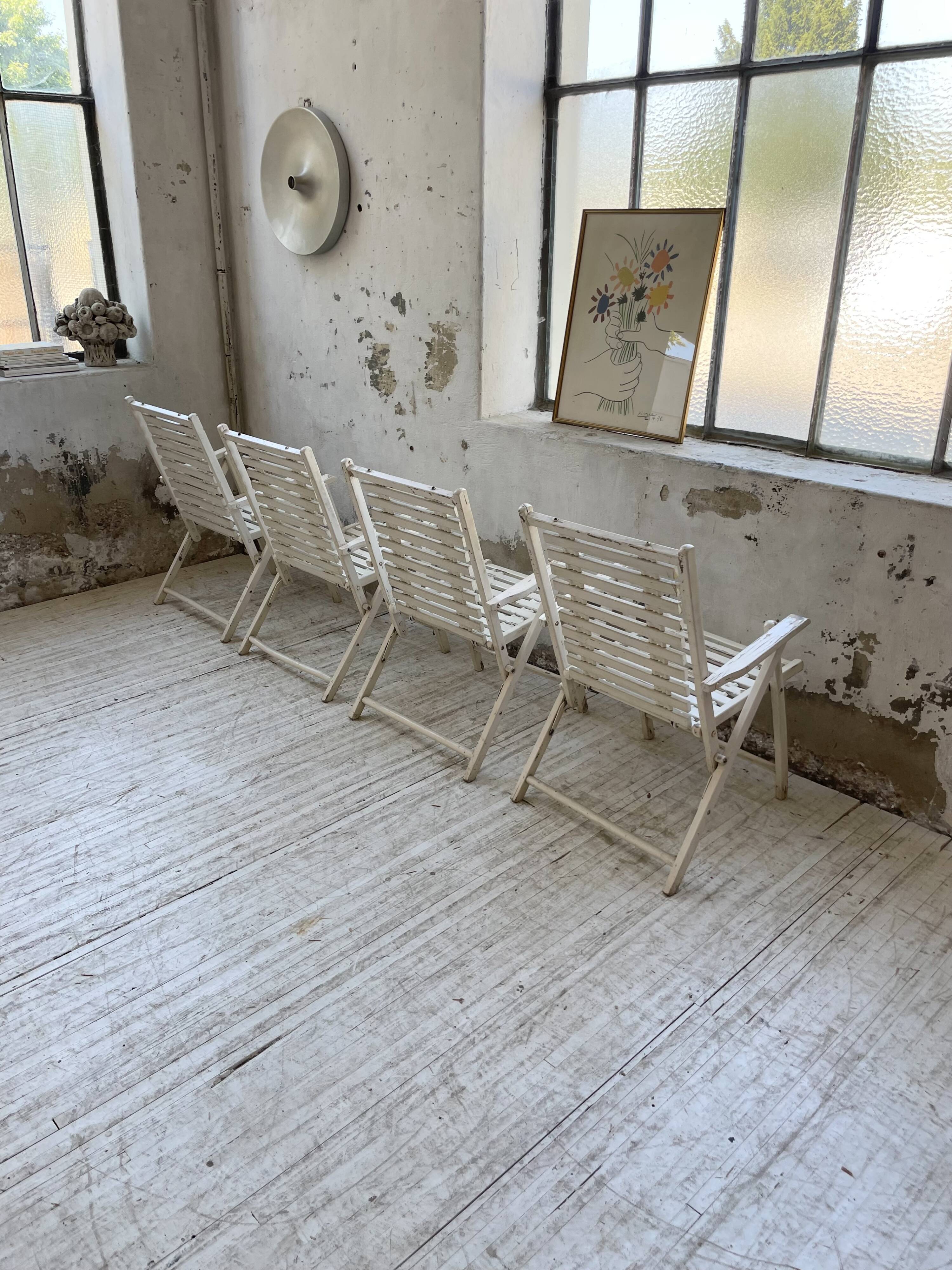 4 white wooden garden chairs