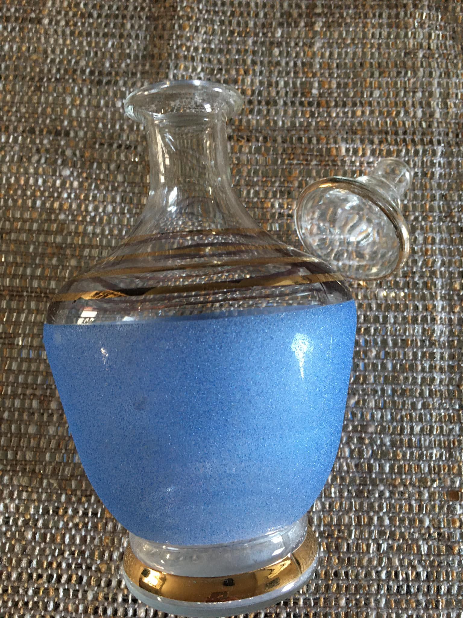 Antique carafe in blue granite glass and gilded edging