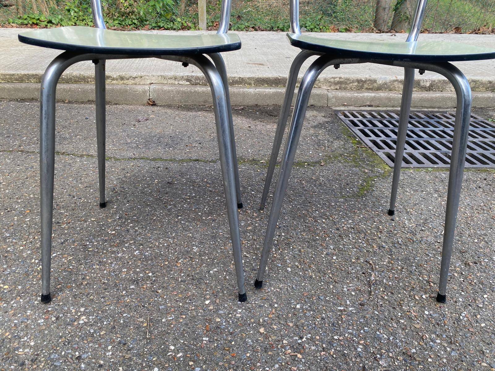 2 light green Formica and steel chairs from the 1980s.
