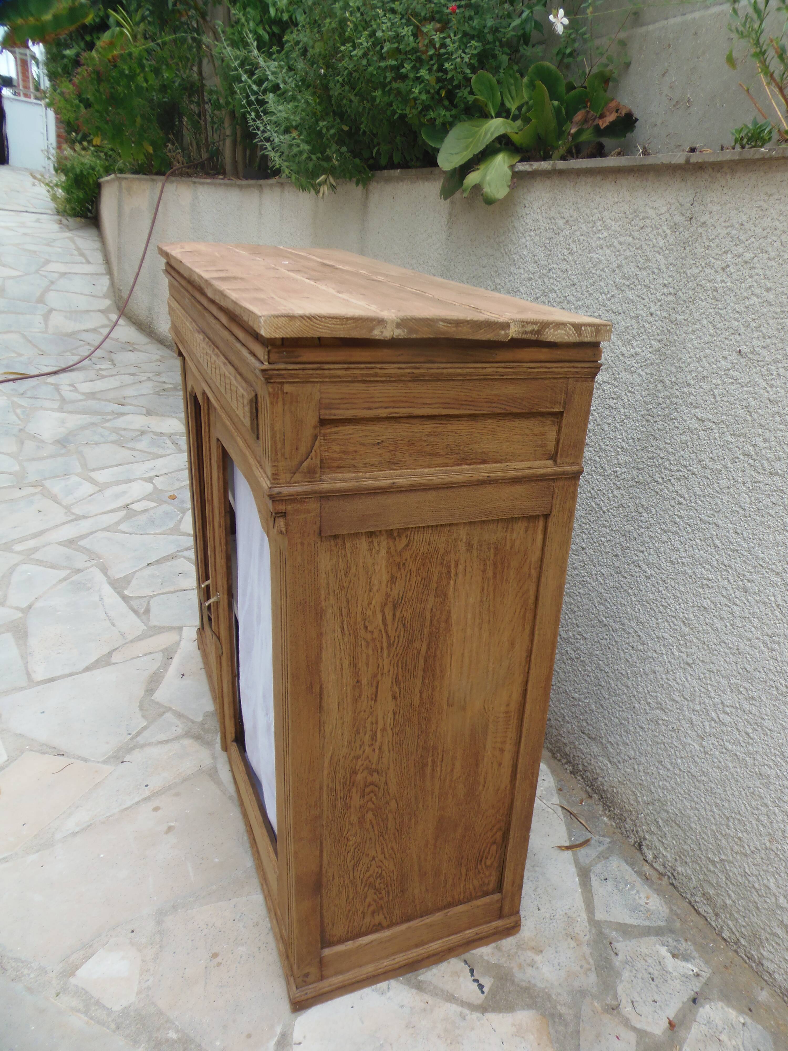 Antique wooden sideboard, fabric doors and pearl grey shelves.