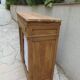 Antique wooden sideboard, fabric doors and pearl grey shelves.