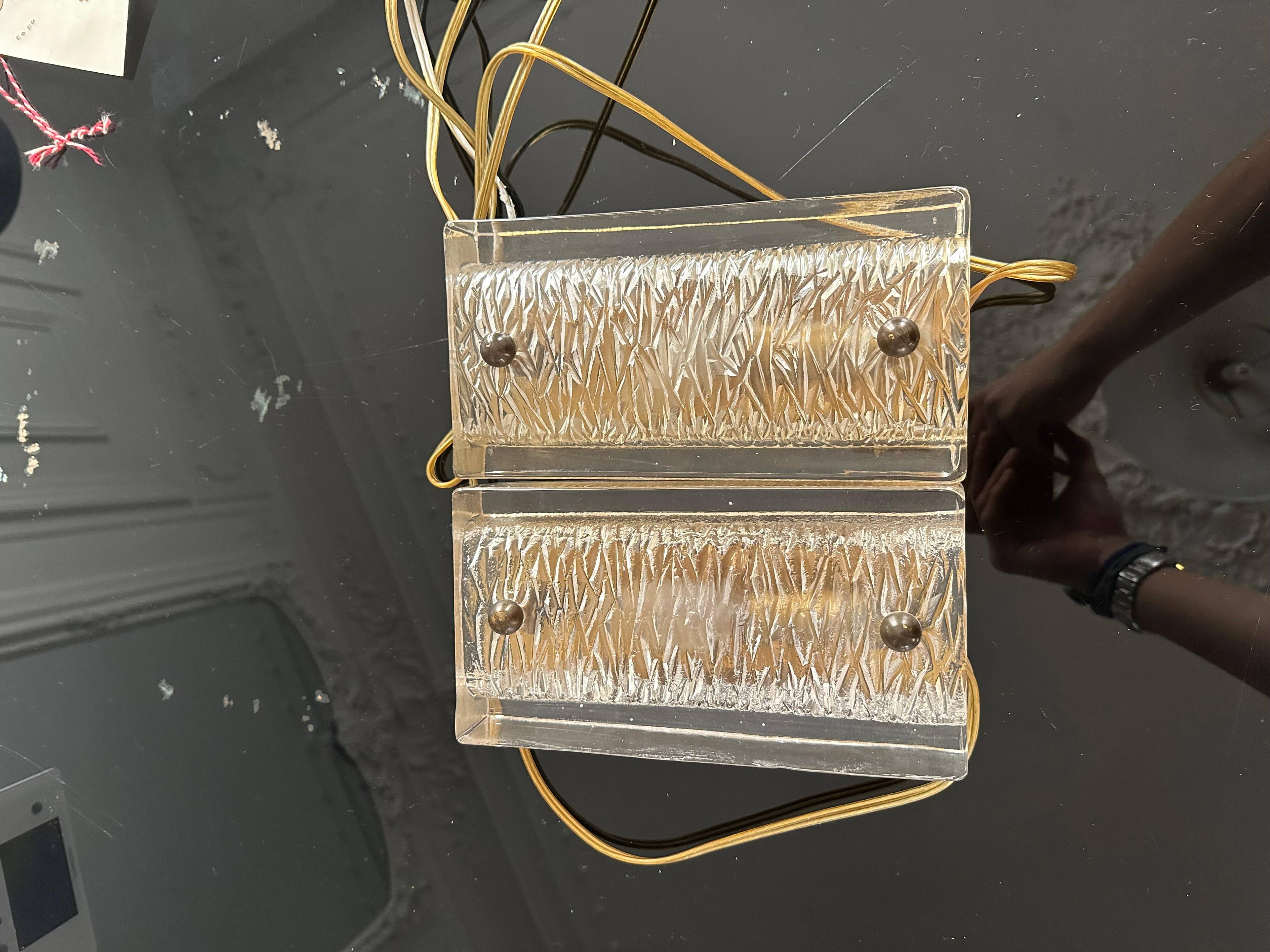 Pair of Orrefors wall lights in cast glass and brass, Sweden 1960.