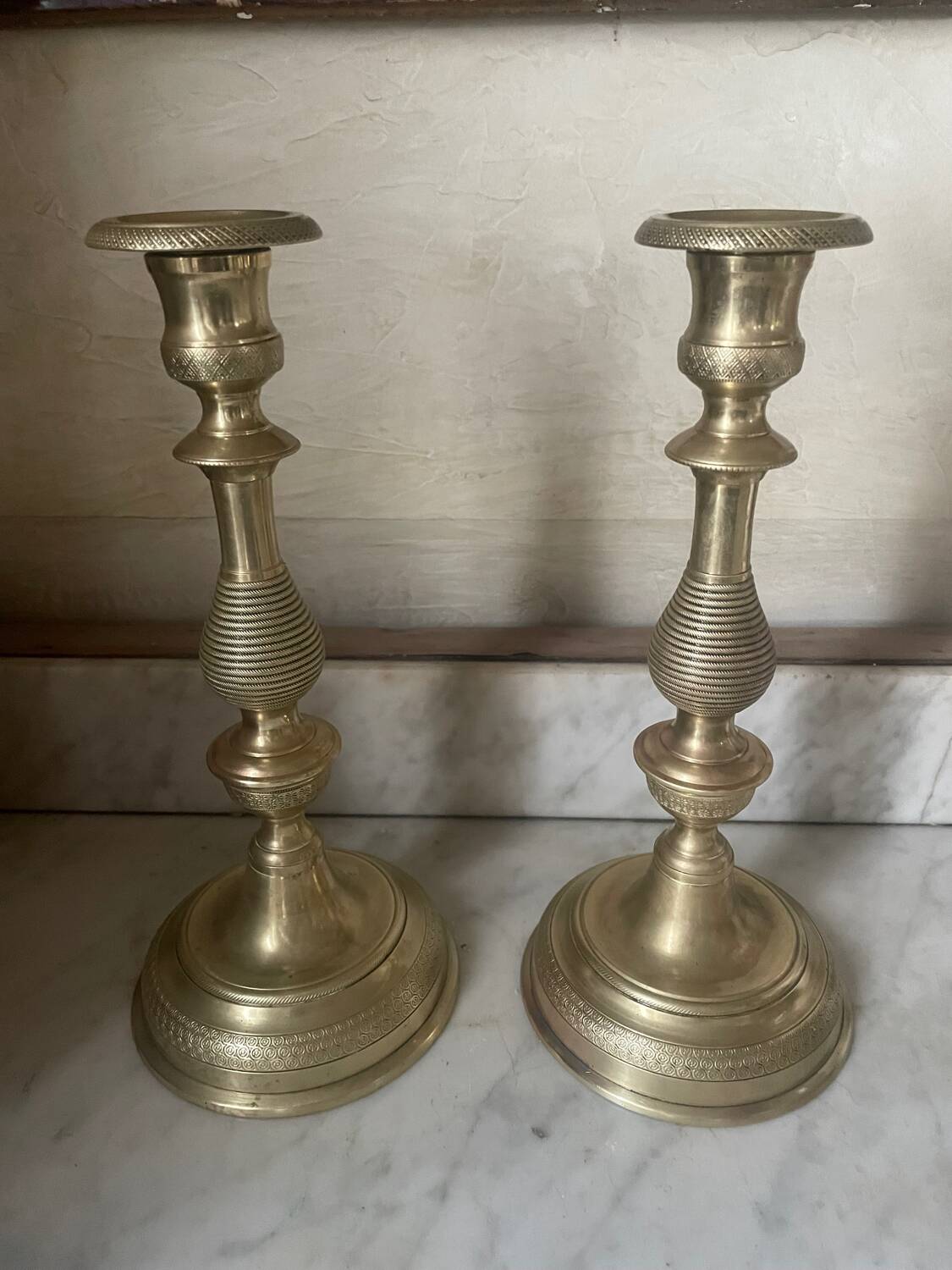 Antique pair of gilded bronze candlesticks