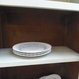 Vintage furniture of shallow depth re-enchanted in grey-green.