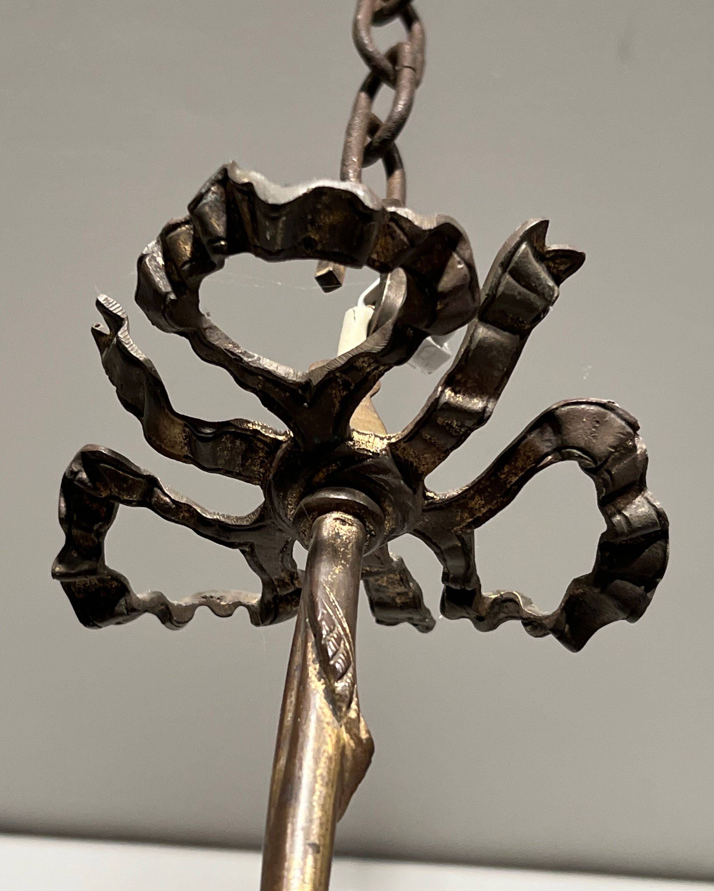 Empire-style bronze chandelier with 3 arms of light topped with eagle heads. French work. Circa 1900.