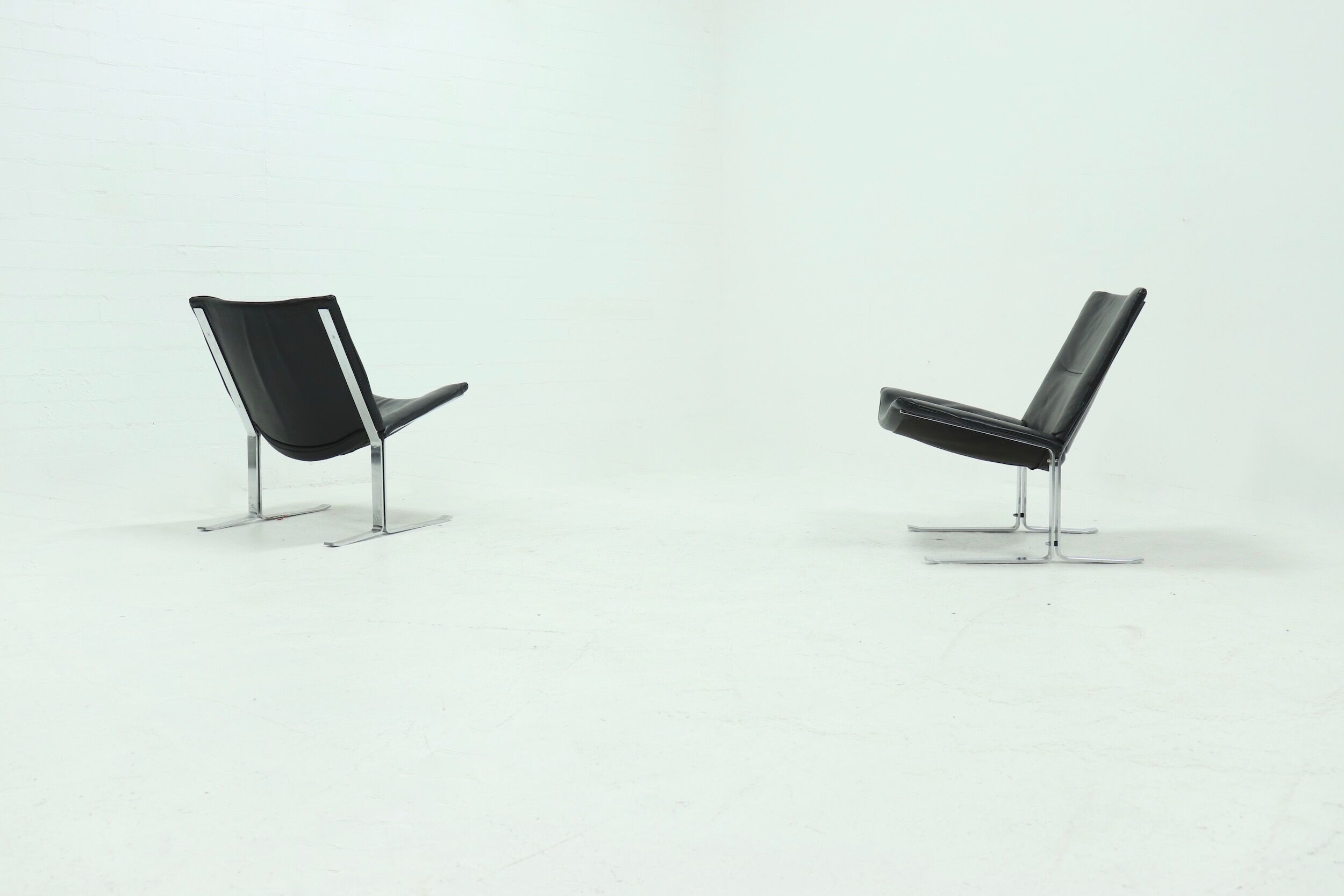 Set of 2 Danish lounge chairs by Kebe Møbler model Eagle with black leather.