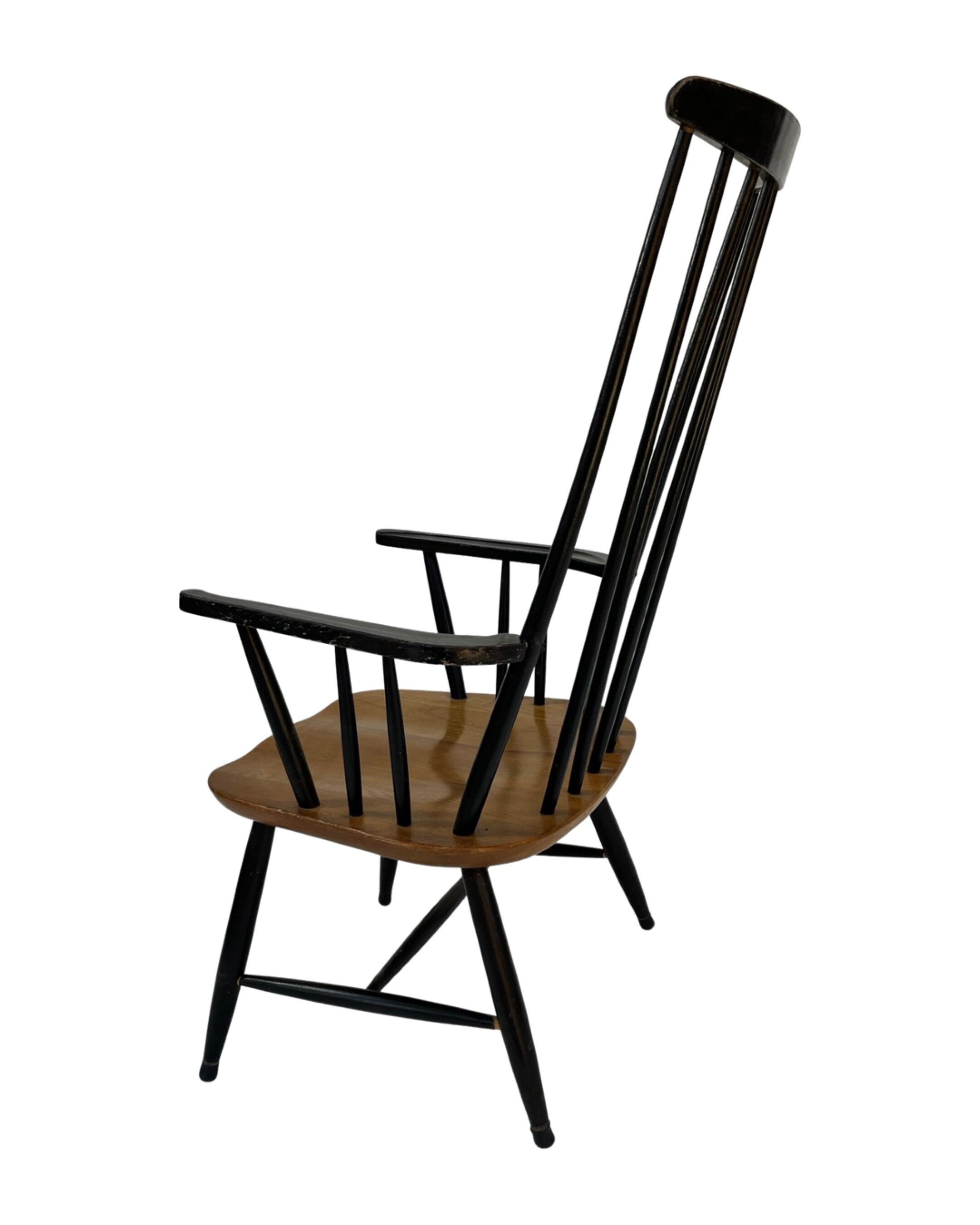 Vintage easy chair with high back and armrest from the 60s