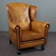 Antique armchair in patinated sheepskin