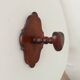 Vintage wall coat rack in carved solid wood, popular art.