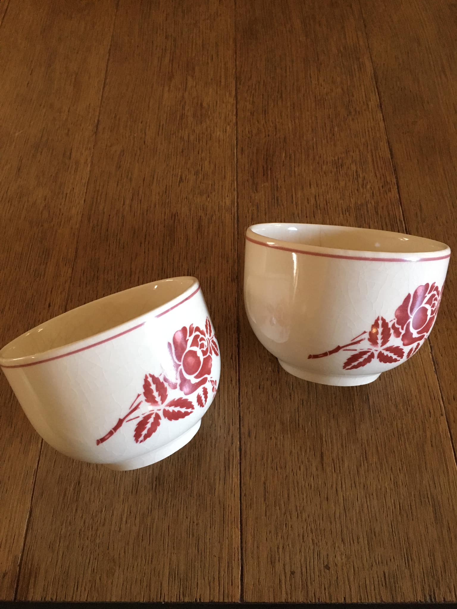 2 antique earthenware cups, red flower motifs
