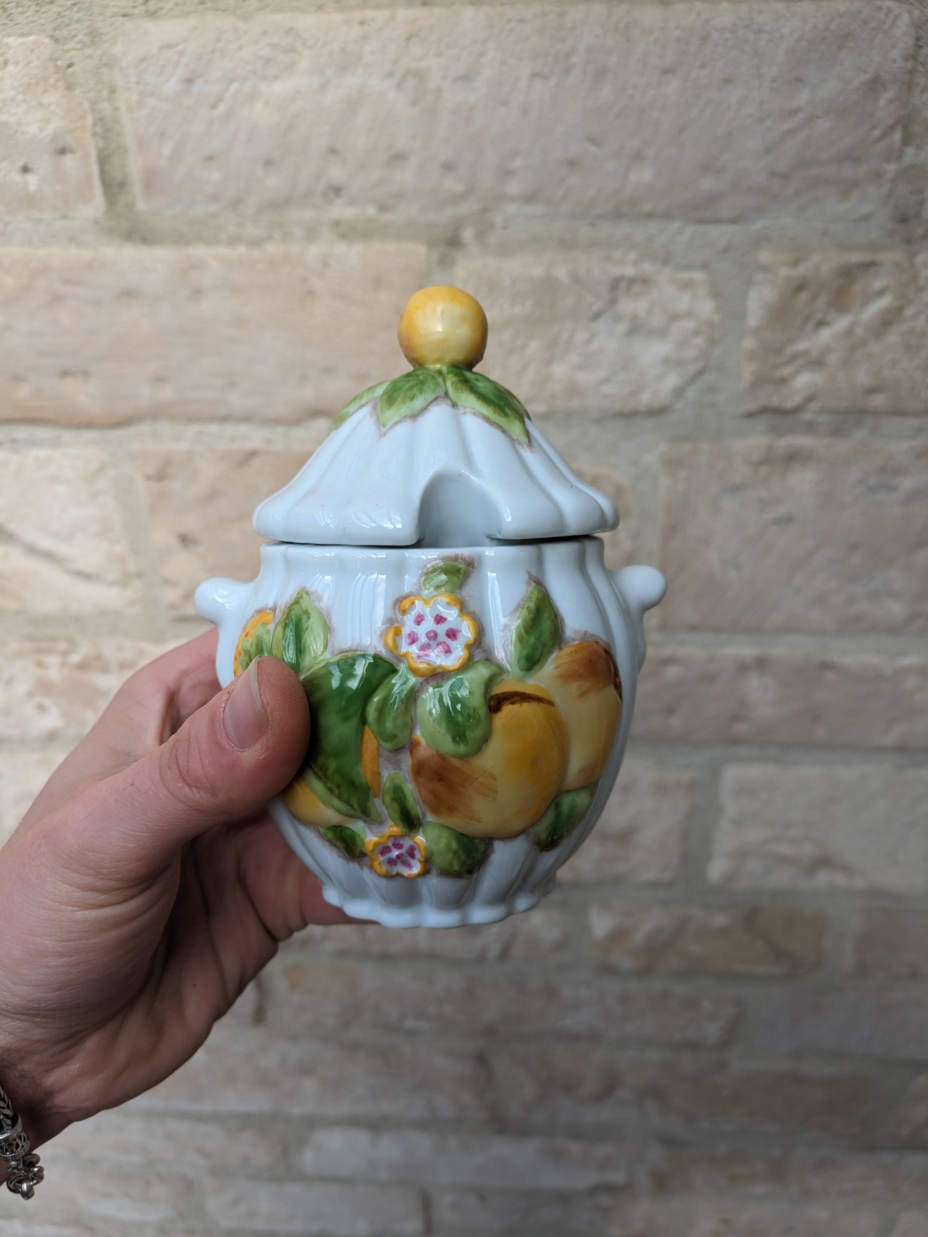 Old ceramic sugar bowl with yellow fruit motif