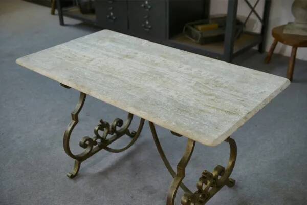 Side table with a gilt wrought iron base attributed to Gilbert Poillerat, with a travertine top, 1940s