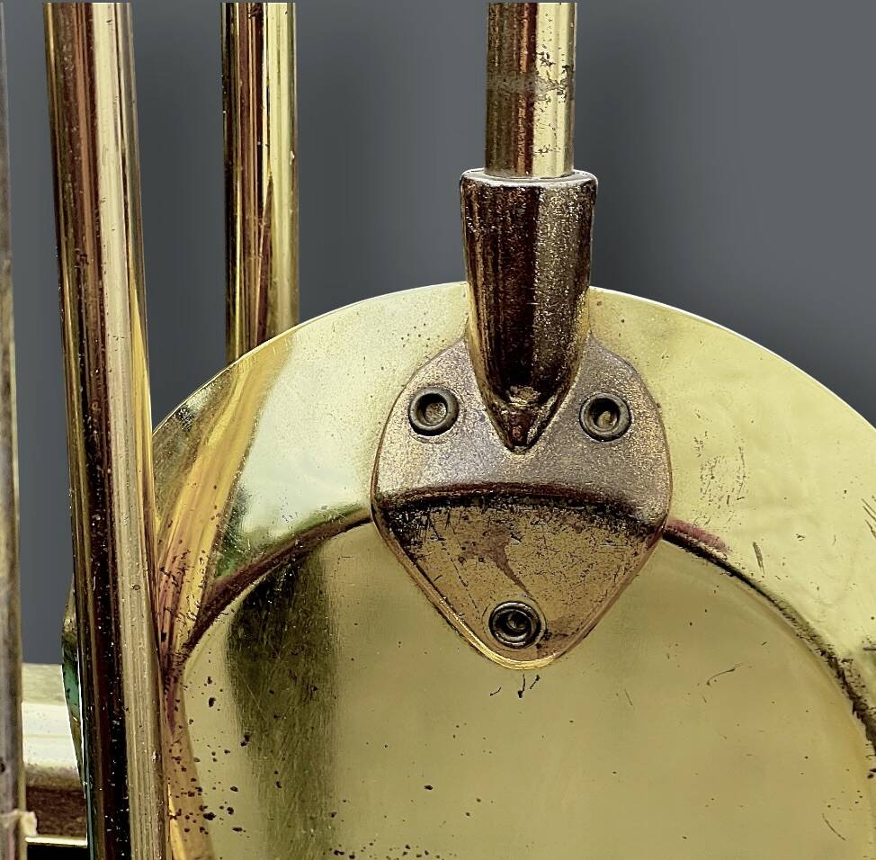 Antique fireplace tool in gilded zamak with duck head designs.