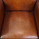 Vintage set of 4 sheepskin leather dining chairs on castors