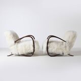 Pair of Jindrich Halabala H 269 lounge chairs in mongolian sheepskin