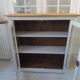 Display case, old shallow sideboard re-enchanted in cloud gray.