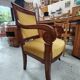 Armchair with scroll arms and sabre legs in mustard velvet, 19th century.