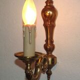 Simple wall sconce in classic Empire style in vintage French bronze.