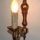 Simple wall sconce in classic Empire style in vintage French bronze.