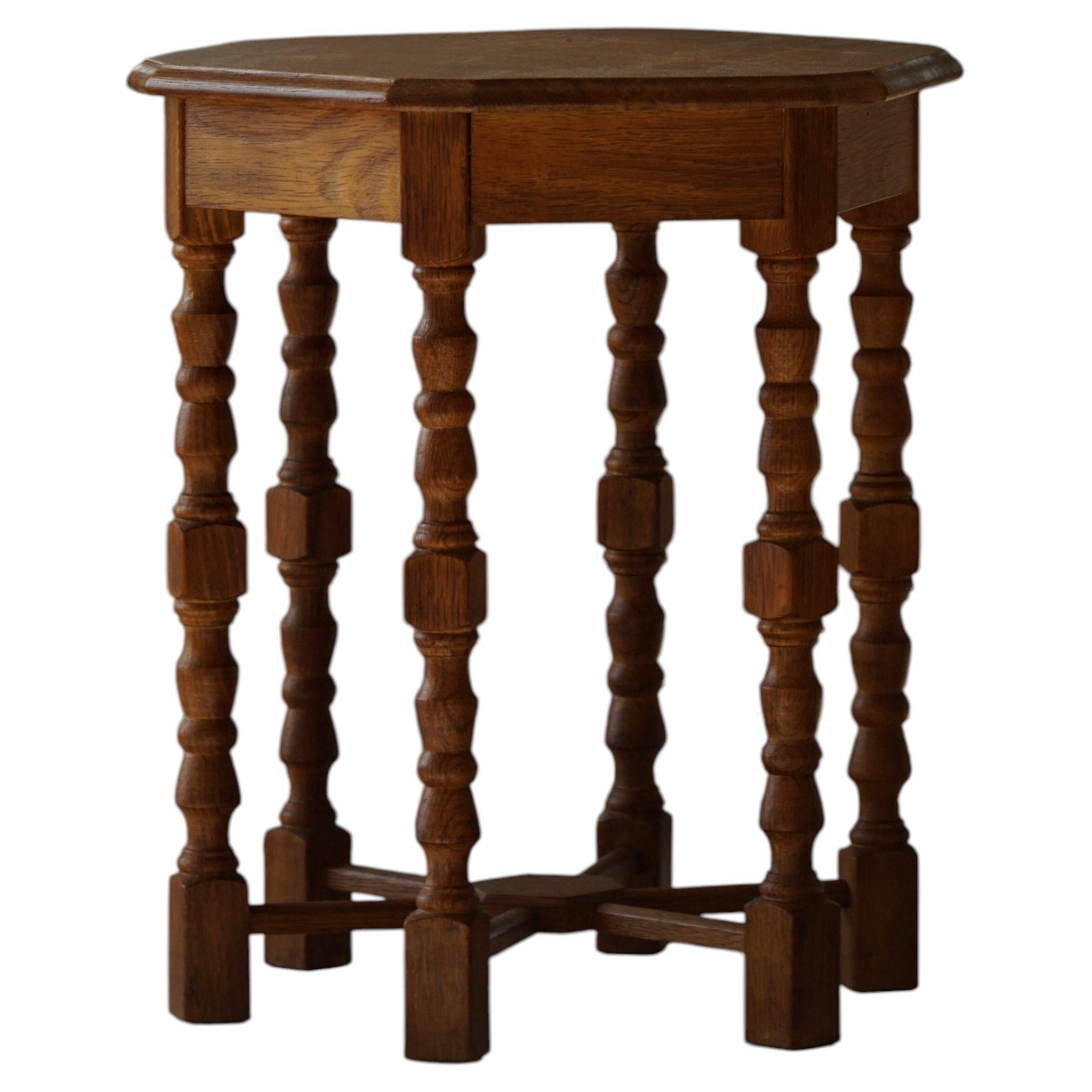 Danish hexagonal side table in oak with turned legs, 1950s.
