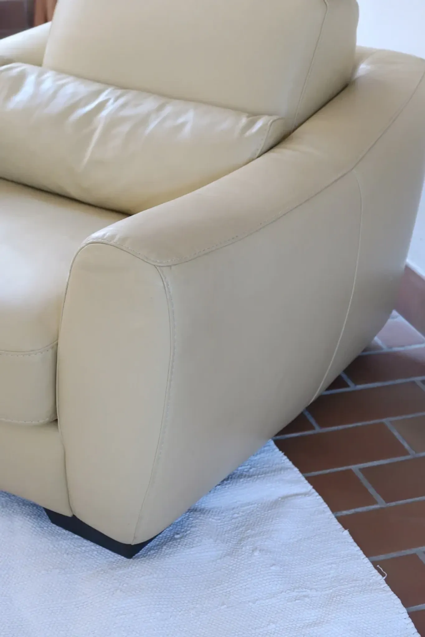 Vintage club armchair in butter yellow faux leather from the 1980s.