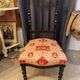 Fireplace or changing chair period 1900 in black lacquered wood and printed fabric