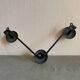 2 black and yellow metal wall coat racks