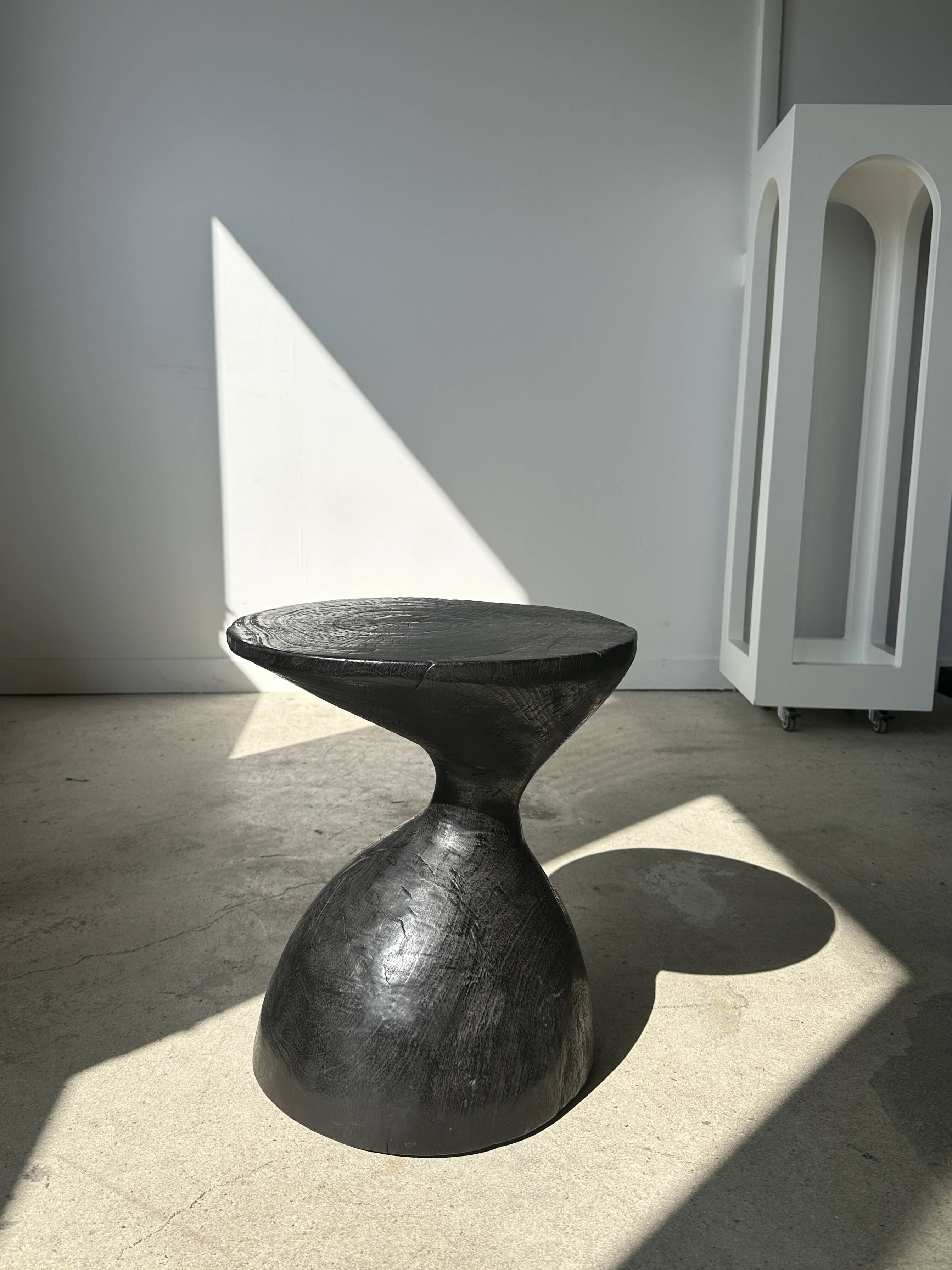 Solid wood (monoxyl) side table, organic shape, black color