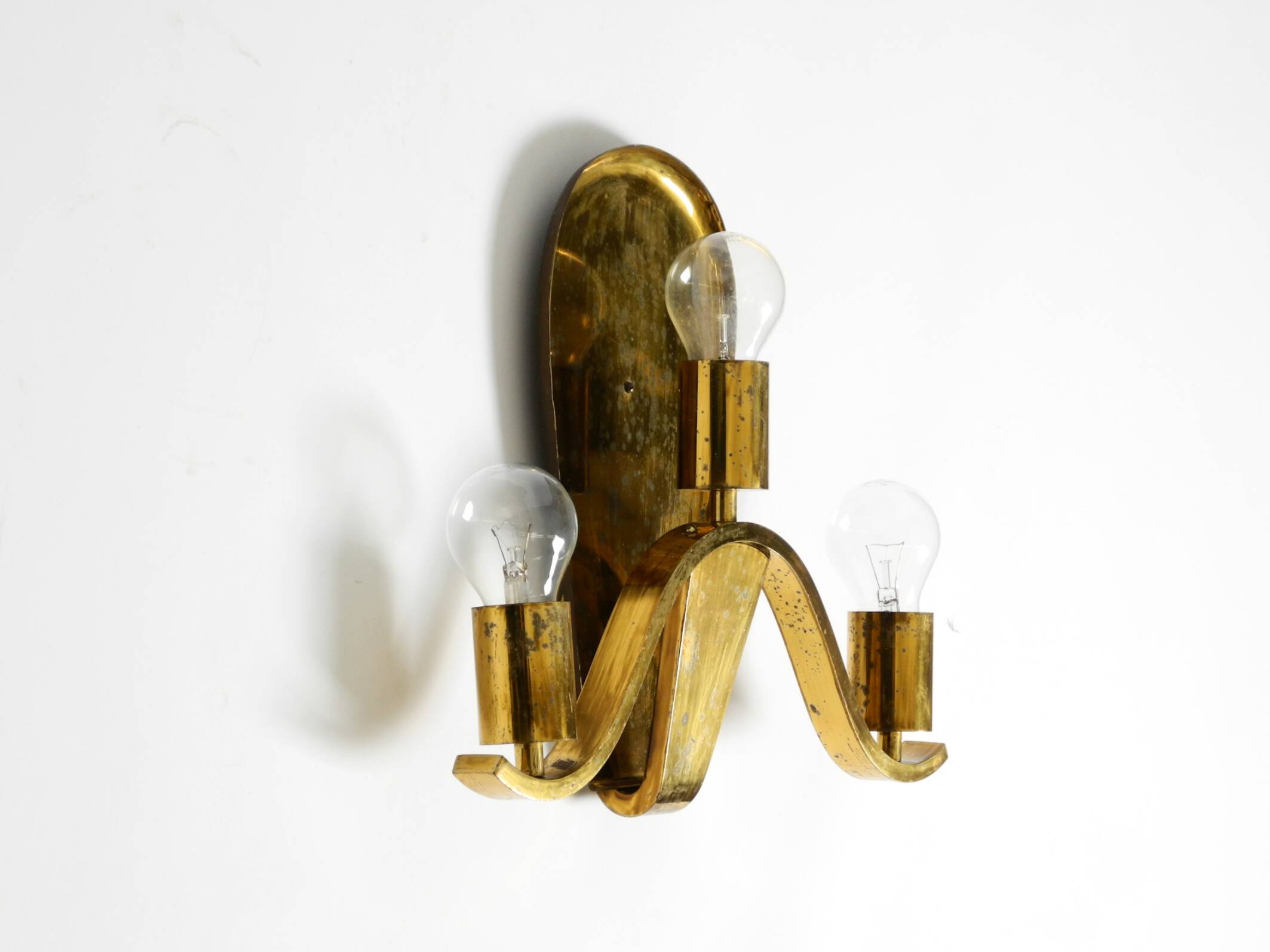 Large heavy Mid Century brass wall light from a German church