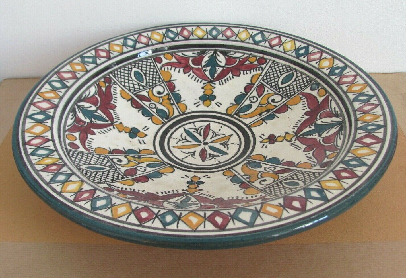 Ceramic dish decorated with yellow and purple decoration
