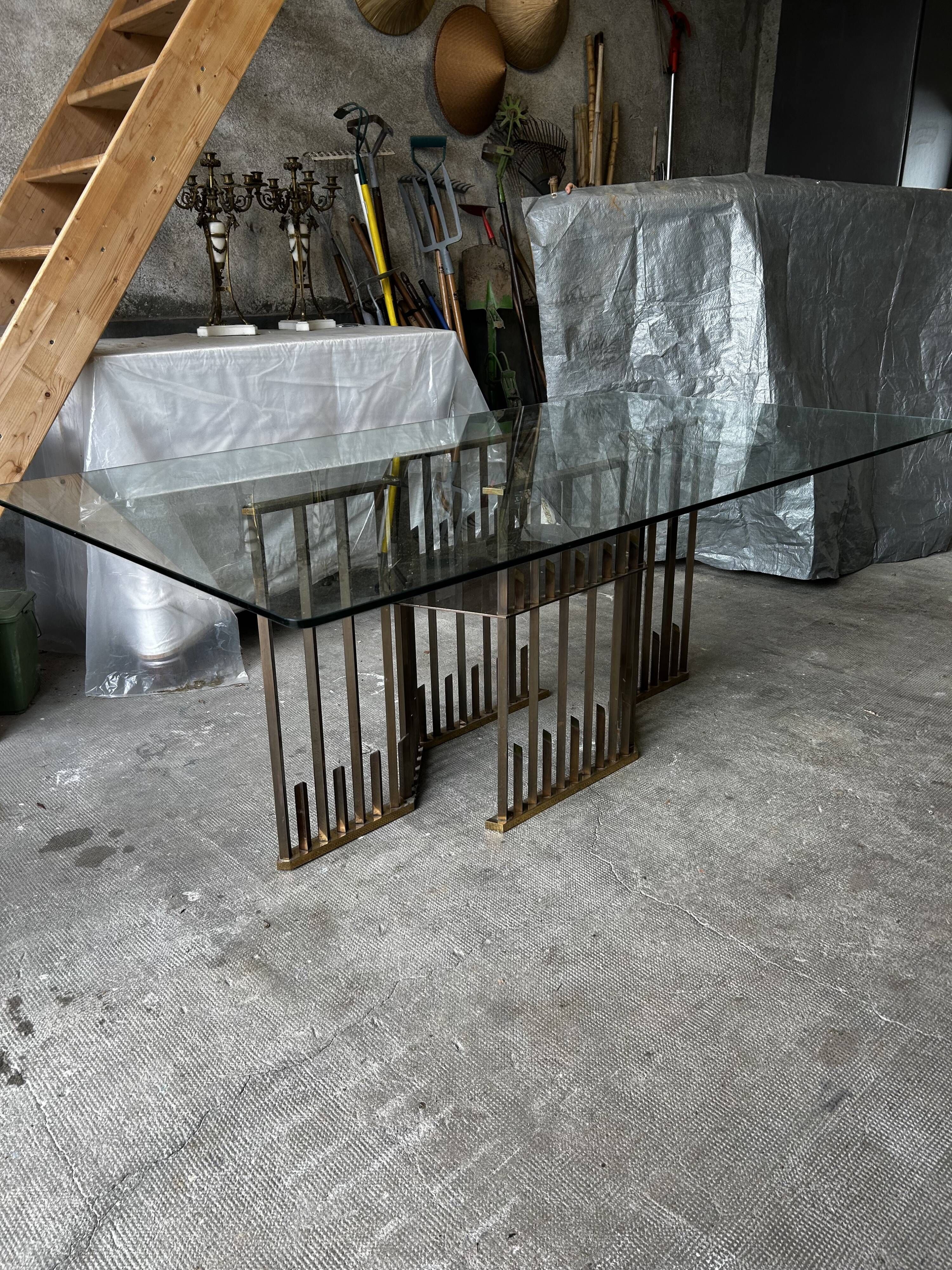 Dining table with brass base in the style of Willy Rizzo, 1970s.