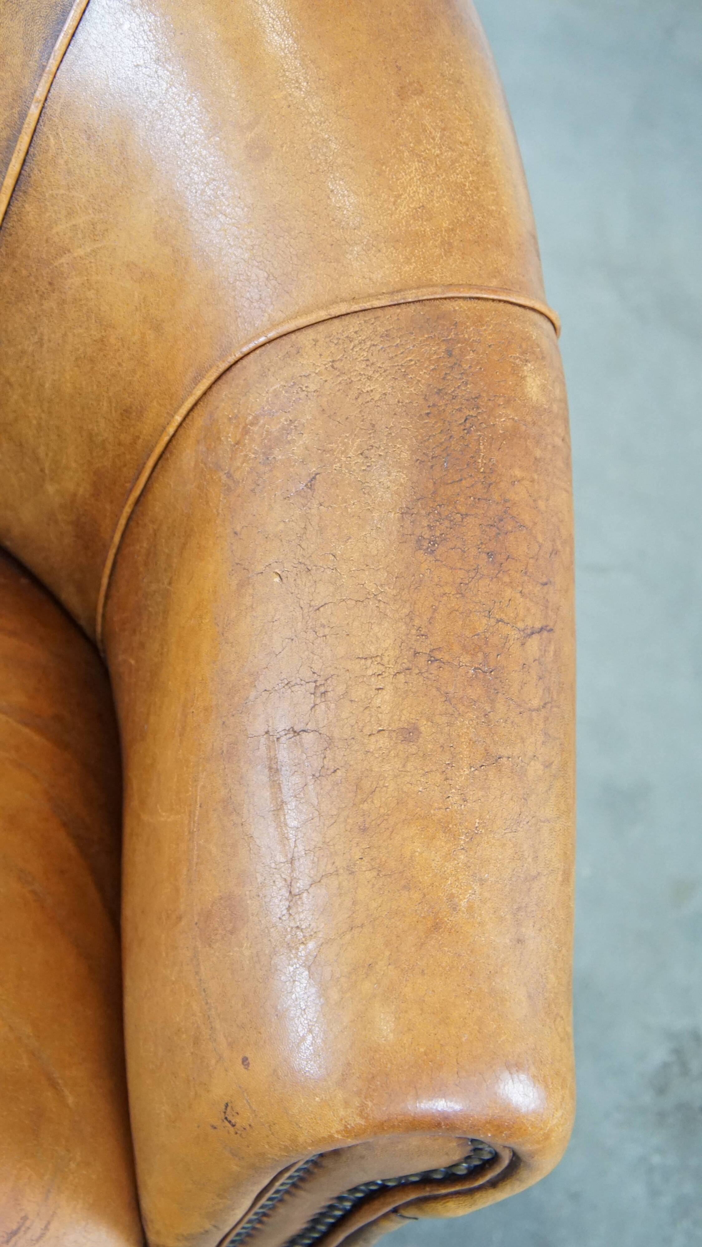 Cognac-colored sheep leather club chair with patina