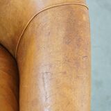 Fauteuil club en cuir de mouton patiné couleur cognac