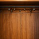Antique walnut burl wardrobe with central mirror and large drawer.