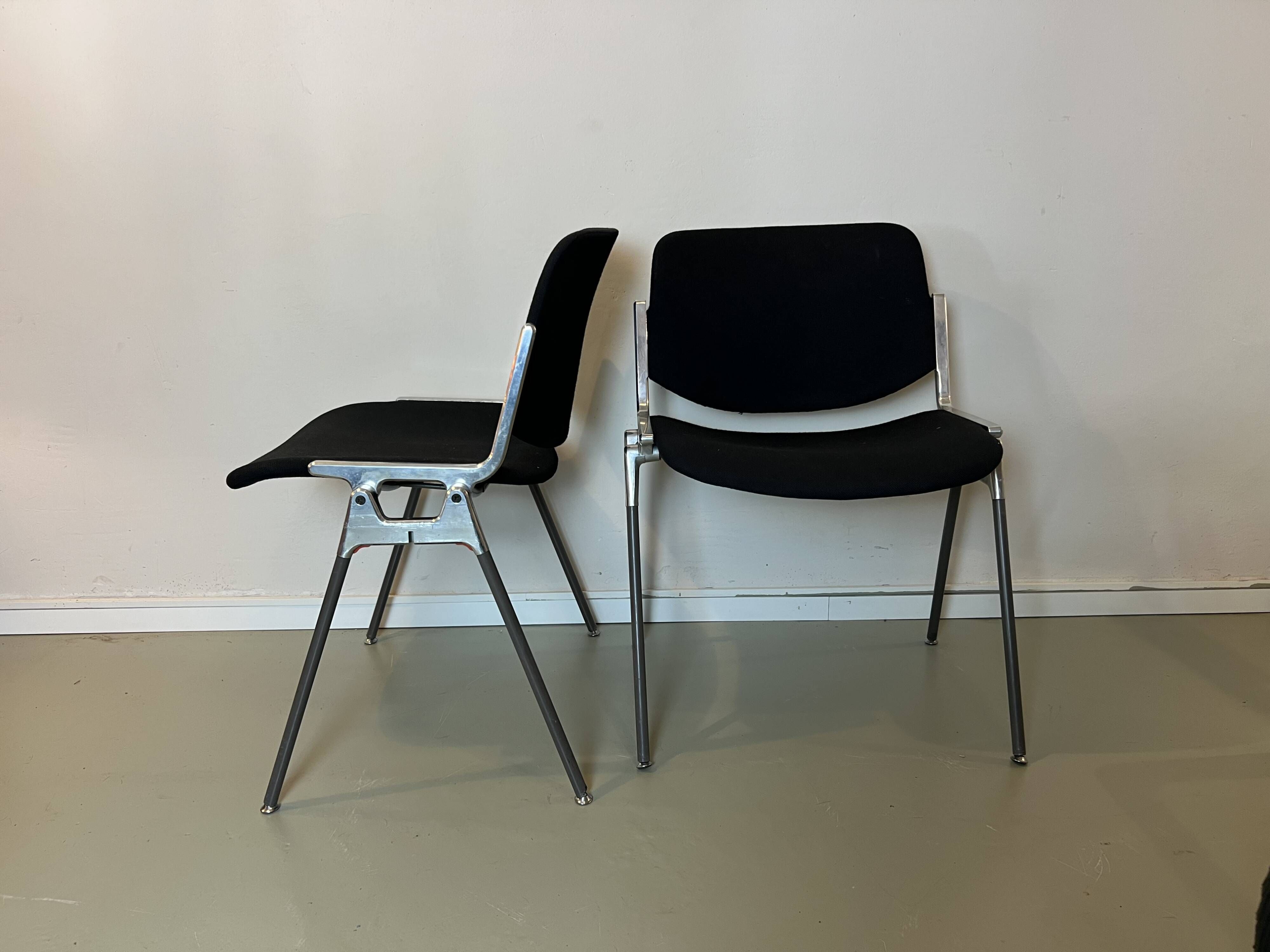 Black DSC chairs by Giancarlo Piretti for Castelli from the 60s/70s.