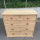 Victorian commode from the 19th century stripped to raw solid wood with ceramic knobs.