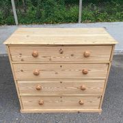 Victorian commode from the 19th century stripped to raw solid wood with ceramic knobs.