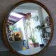 Old gilded wood oval mirror
