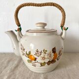 Vintage porcelain and rattan teapot