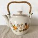 Vintage porcelain and rattan teapot