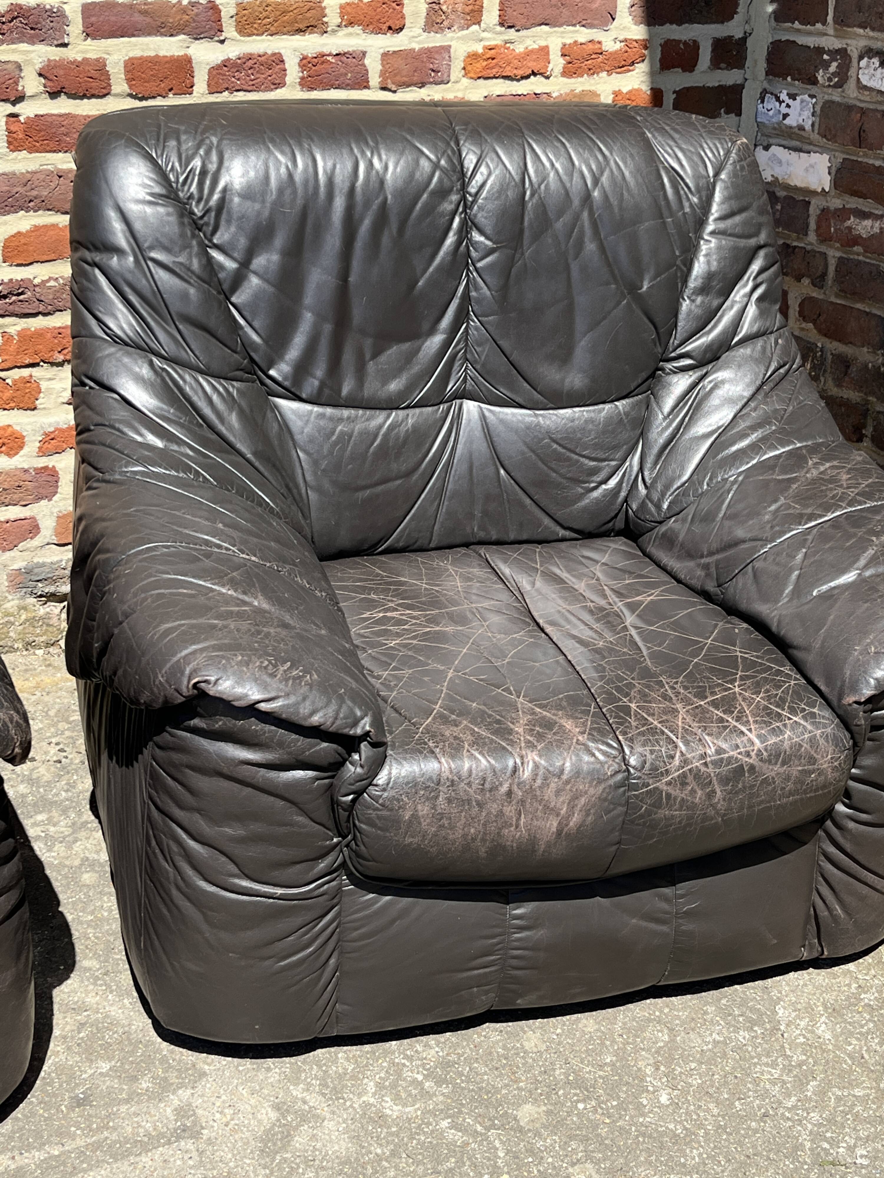Pair of patinated leather club armchairs
