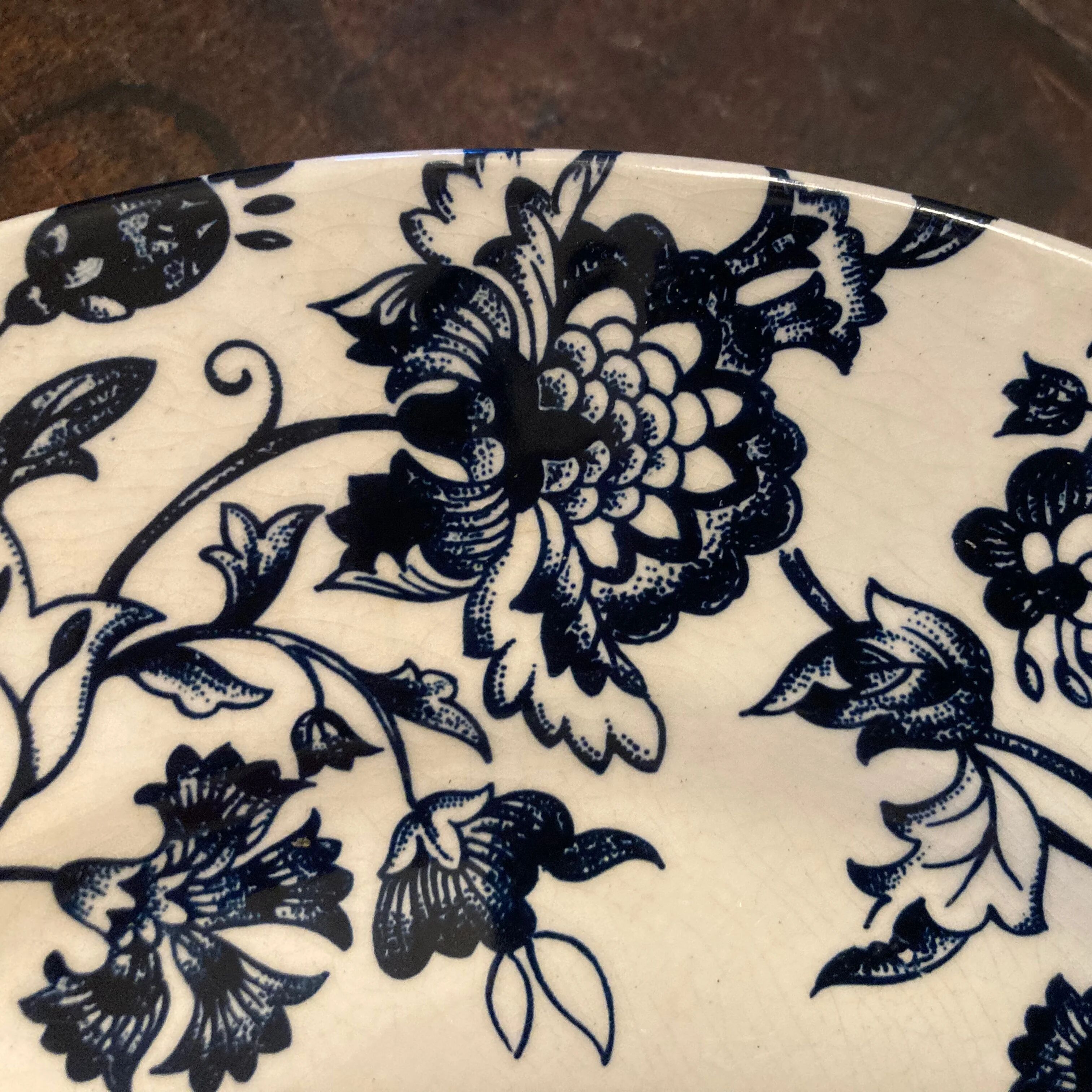6 antique flat plates in earthenware with blue flower decoration.