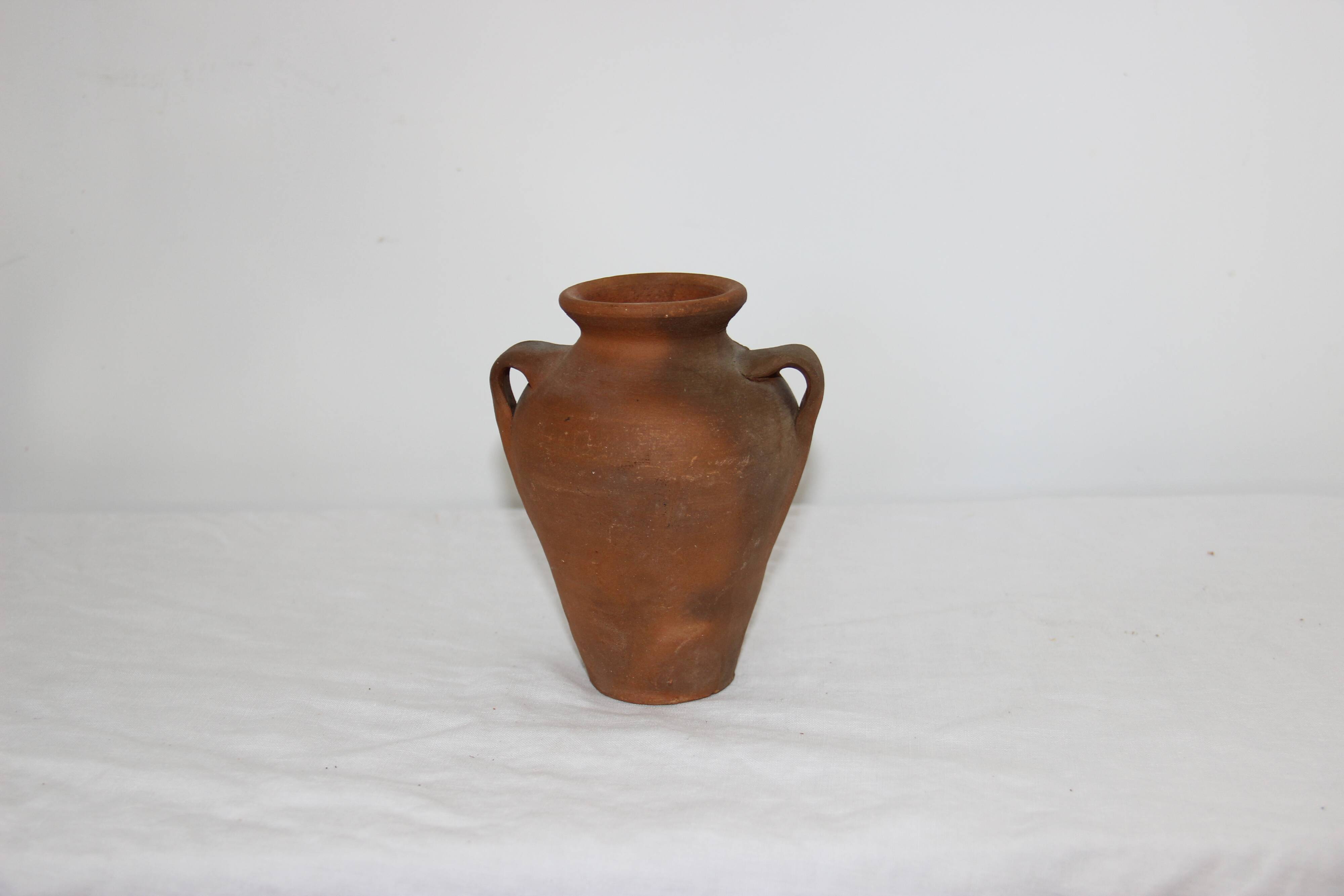 Old little terracotta jar